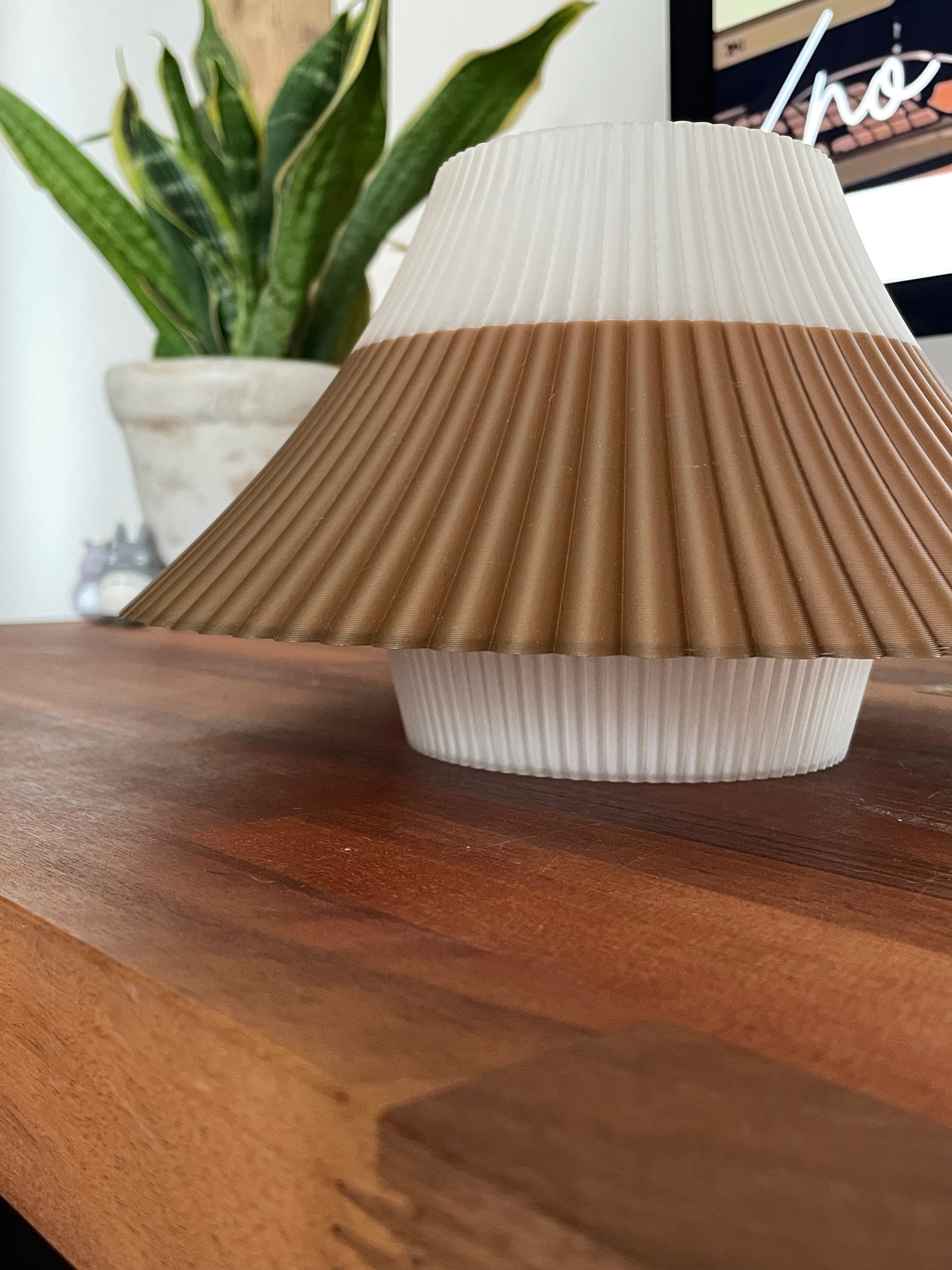 3D printed brown and white Fuji desk lamp on a wooden desk