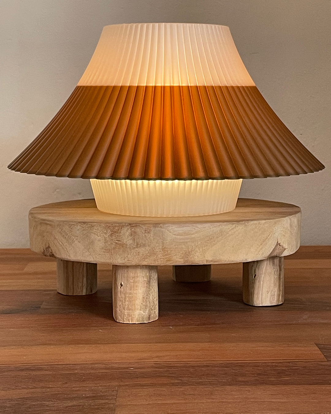 3D printed brown and white Fuji desk lamp on a wooden stand