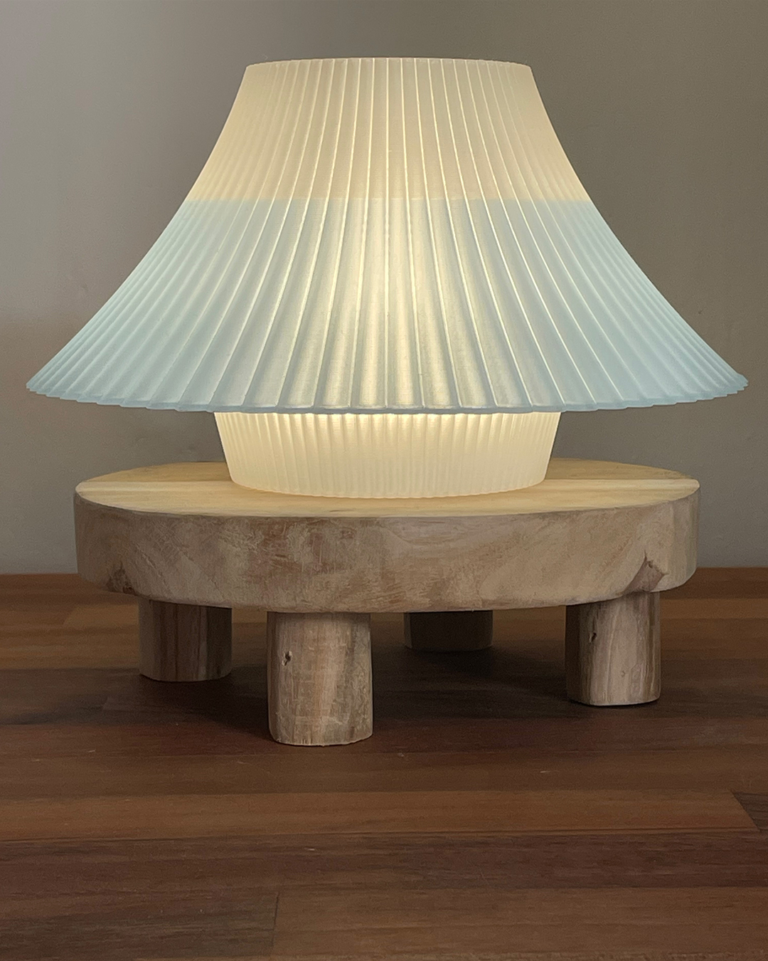 3D printed blue and white Fuji desk lamp on a wooden stand